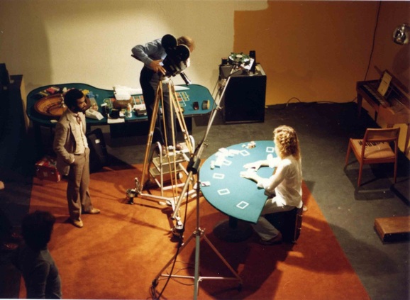 Steven Carlson performing card & poker chip flourishes on the set of the movie, Jackpot - 1981